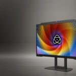 Image showing the Atomos Studio PRO-2710 Color Critical Reference Monitor in front of a grey gradient.